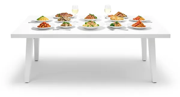 A long table laid with a full plate at every place.