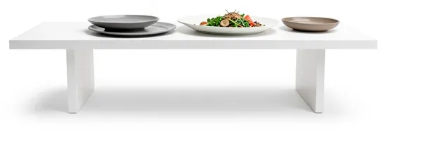 A table with three plates set out at once, a starter, a main and a dessert.
