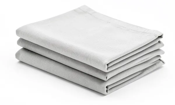 A stack of folded clean cloths, the kitchen wiped down and restocked.