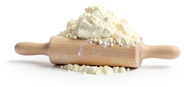 A heap of flour on a wooden rolling pin, everything made from scratch.