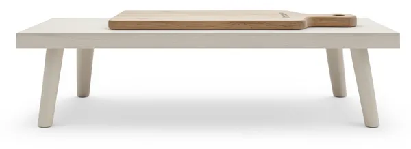 A chopping board left on a bare table, moved without knowing what depends on it.