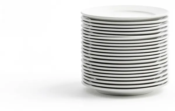 A tall stack of clean, empty plates.