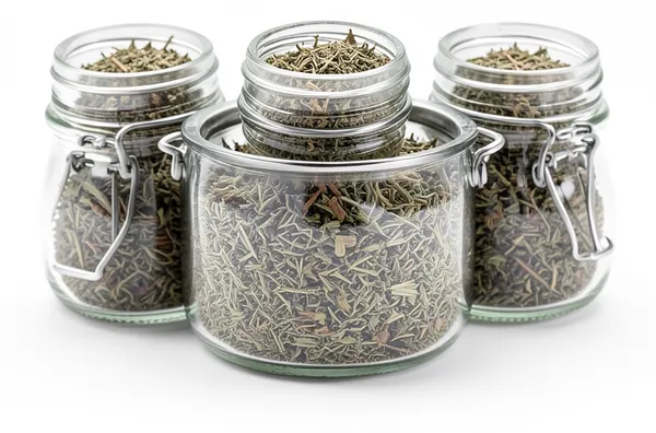 Jars of dried herbs, a sixth herb because it was in the cupboard.